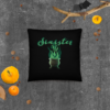 Sinister festive Halloween pillow, with greens over an expressively eerie black background.