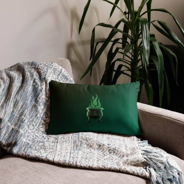 Sinister festive Halloween pillow, with greens over an expressively eerie black background.