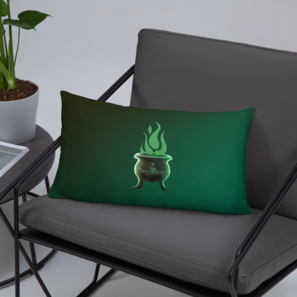 Sinister festive Halloween pillow, with greens over an expressively eerie black background.