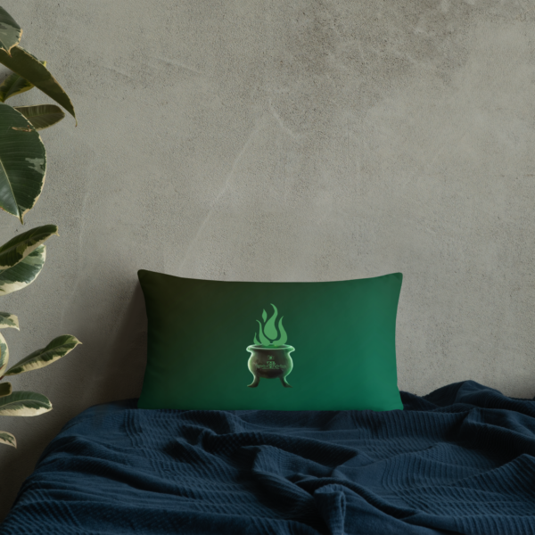 Sinister festive Halloween pillow, with greens over an expressively eerie black background.