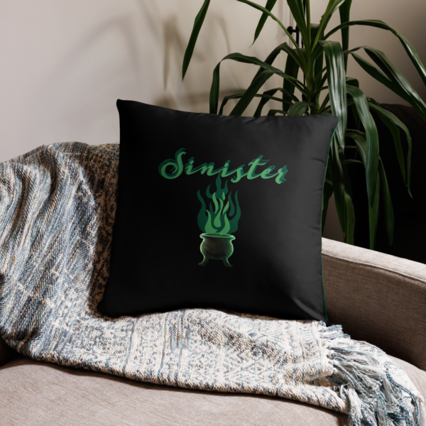 Sinister festive Halloween pillow, with greens over an expressively eerie black background.