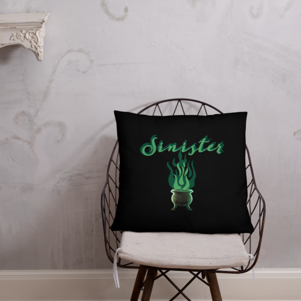 Sinister festive Halloween pillow, with greens over an expressively eerie black background.